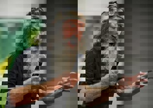 Phil Robertson criticized for praying for 'Jesus man in the White House'; Franklin Graham defends 'Duck Dynasty' patriarch