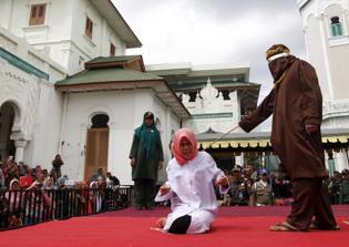 Christian woman, four others caned in Indonesia for breaking Islamic Sharia Law