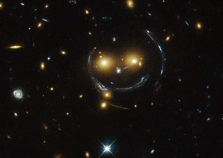 Is the Universe Smiling Back? Hubble Space Telescope Discovers Happy Face in Space
