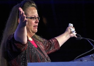 Appeals court revives gay couple's damages claim against Kim Davis