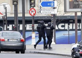 Explosions, Gunshots Reported Near Hostage Situation In Northern Paris