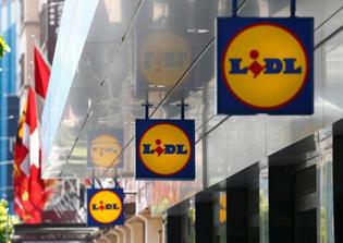 Italian mayor threatens to sue supermarket chain for airbrushing crosses of historic Italian church on promotional posters