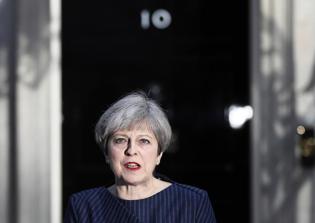 British PM receives charred Bible found at a shrine torched by ISIS