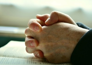 One-fifth of non-religious Britons turn to prayer in a crisis, survey reveals