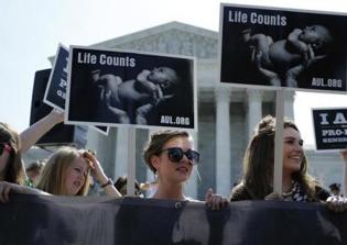 Arkansas governor signs abortion law banning second trimester 'dismemberment' procedure