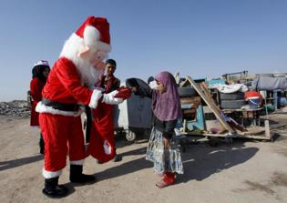 Muslim businessman sets up giant Christmas tree in Baghdad to show unity with Christians