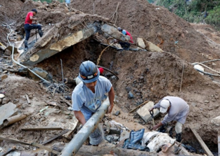 Little hope of finding survivors after landslide buries chapel in Philippines